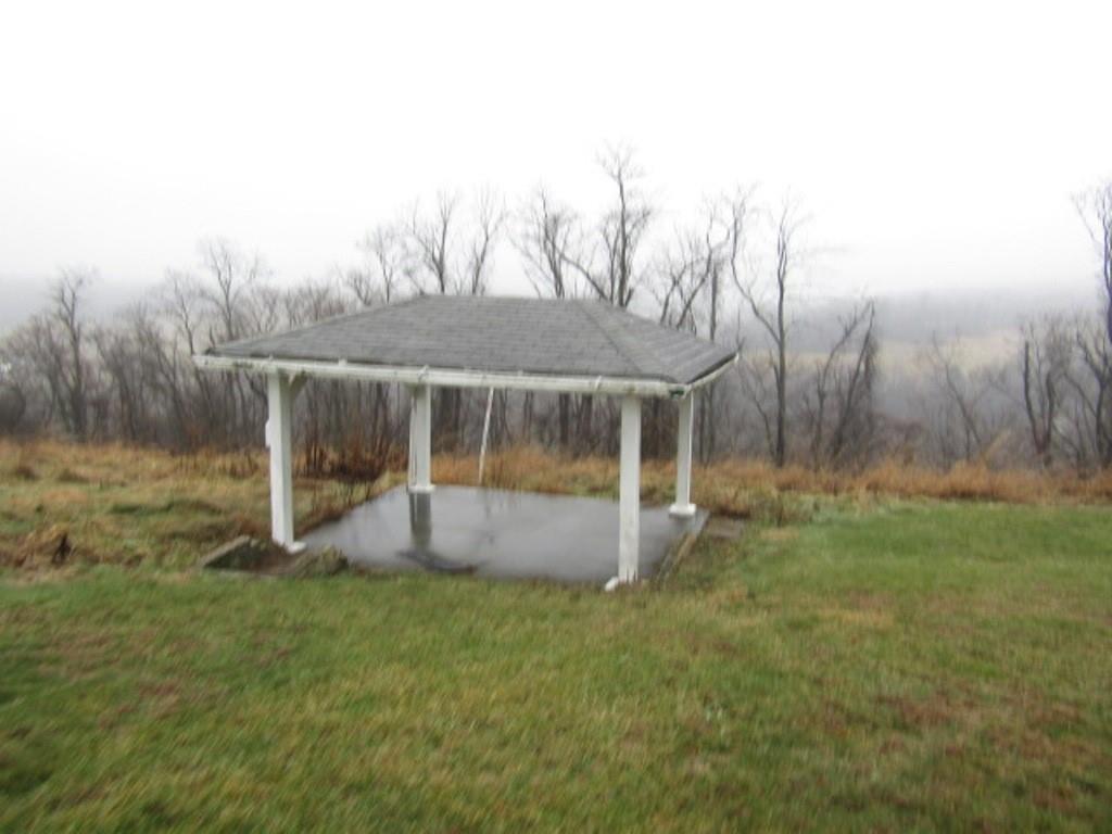 163 Poplar Road Avella, PA 15312 - Photo 5 of 32 a garden with trees in front of it