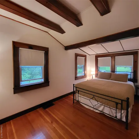 a room with a bed and a window