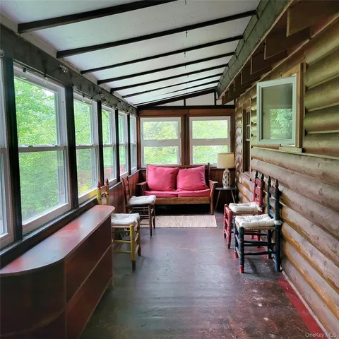 a room with furniture and a large window