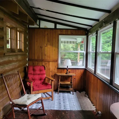 a living room with furniture and a window