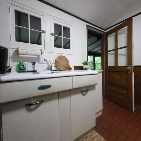 a view of cabinets and window