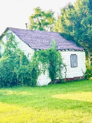 a view of a backyard with a garden