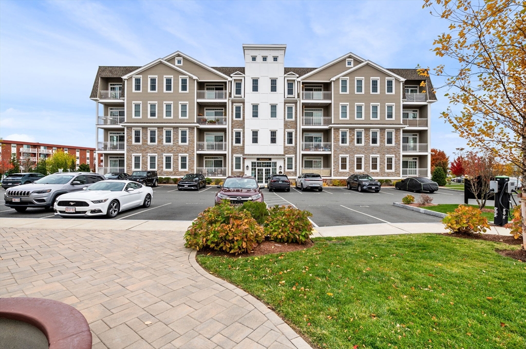 a building view with swimming pool and dinning table and chairs
