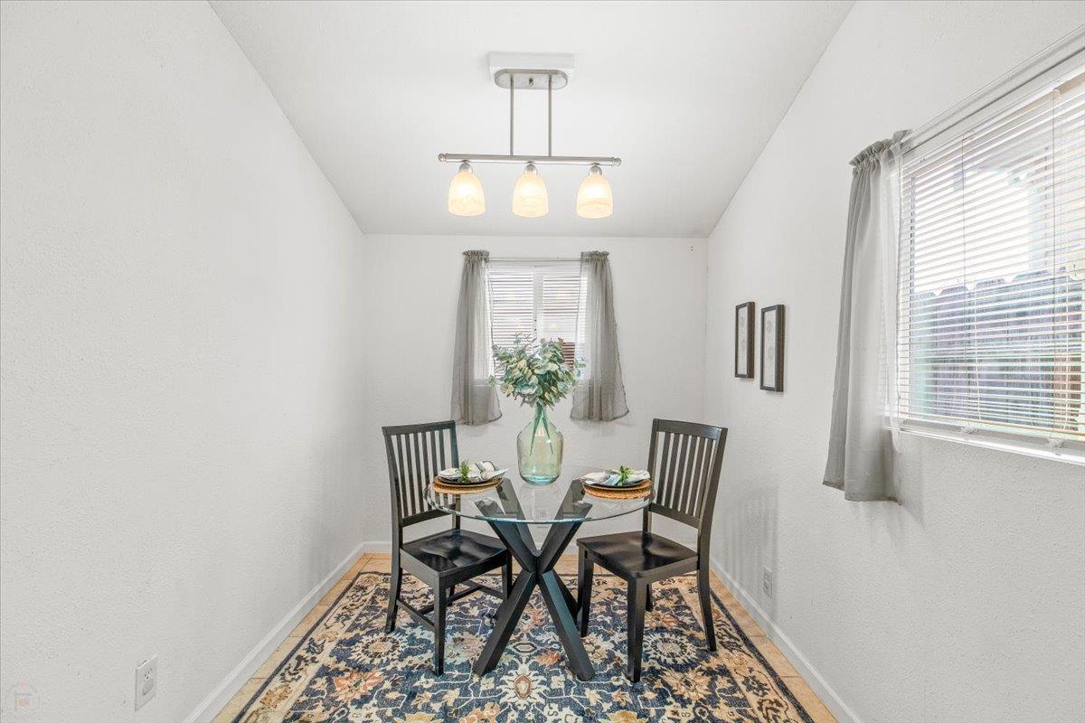 572 Pedersen Road Oakdale, CA 95361 - Photo 19 of 36 a view of a dining room with furniture and window