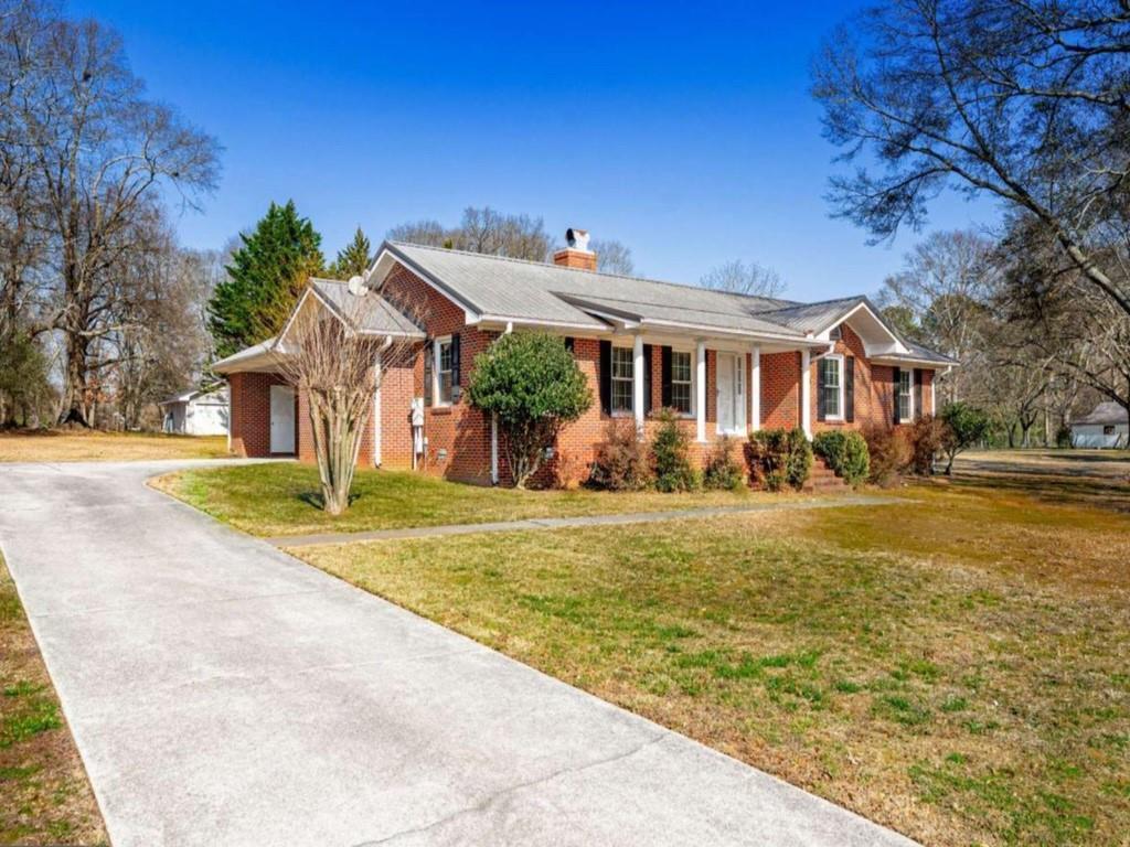 a front view of a house with garden
