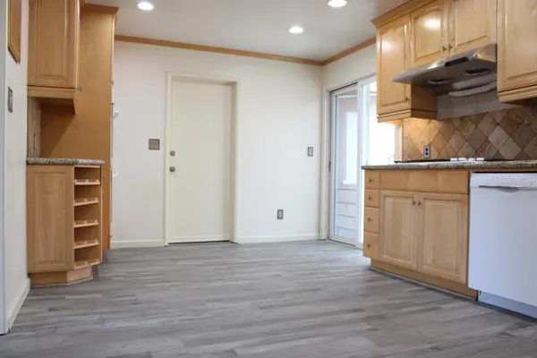 a view of kitchen with wooden floor