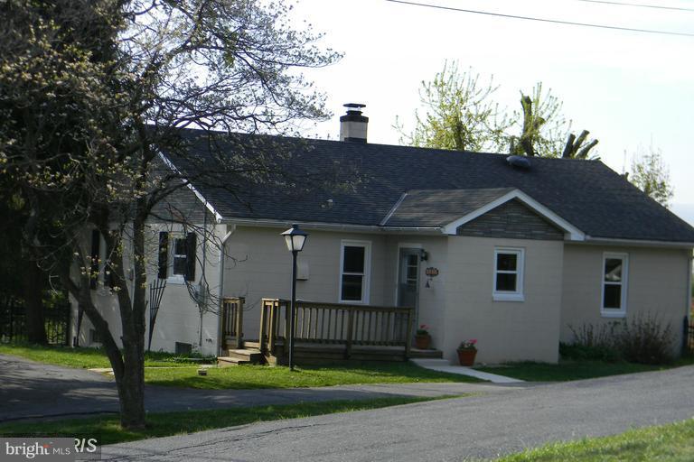 5615 Shookstown Road Frederick, MD 21702 - Photo 17 of 25 a view of a house with a yard