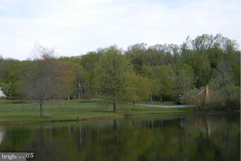 5615 Shookstown Road Frederick, MD 21702 - Photo 25 of 25 a view of a lake with green field