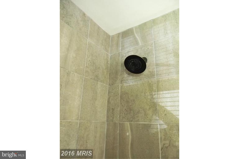 5615 Shookstown Road Frederick, MD 21702 - Photo 9 of 25 a bathroom with a shower