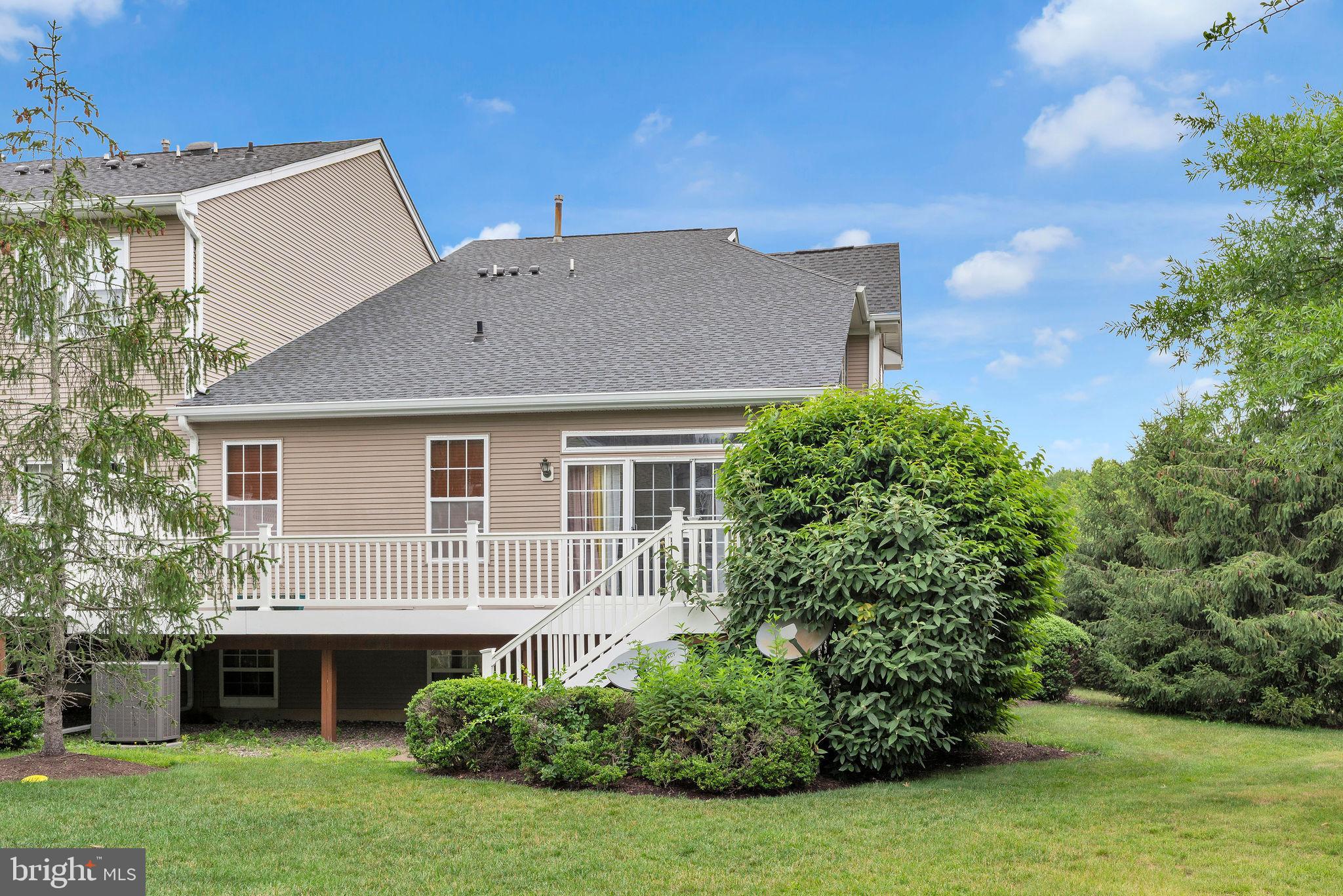 16 Cardiff Court Princeton Junction, NJ 08550 - Photo 46 of 60 a aerial view of a house with a yard and potted plants
