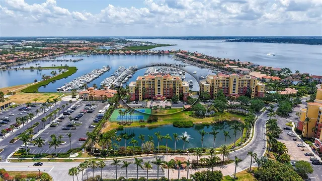 an aerial view of a house with a lake view