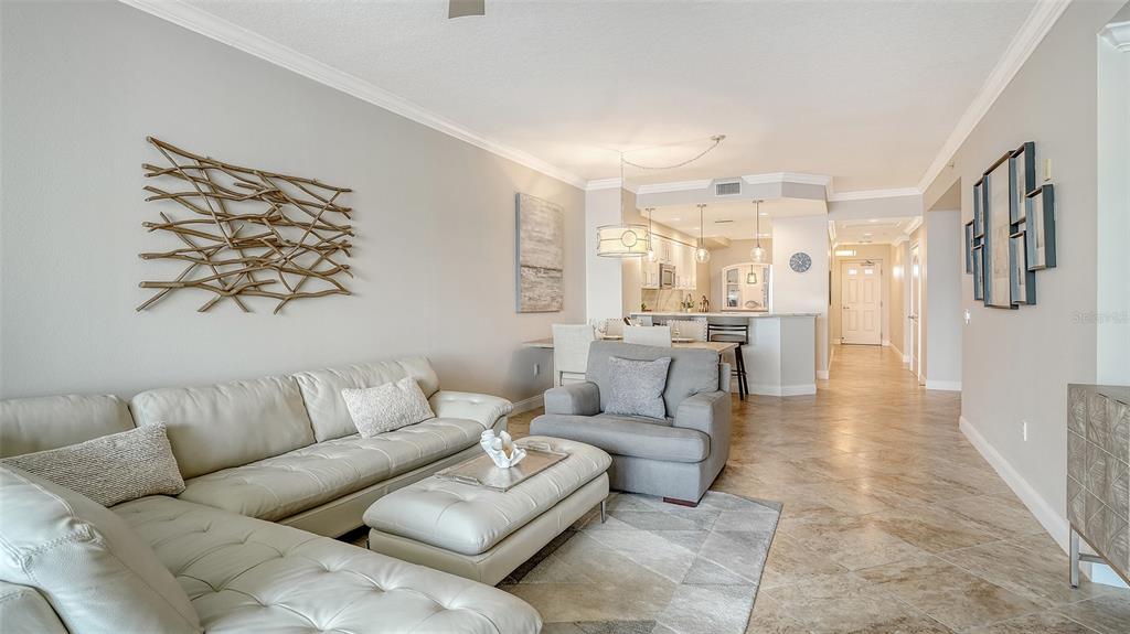 606 Riviera Dunes Way, Unit 306 Palmetto, FL 34221 - Photo 16 of 64 a living room with furniture and a large window