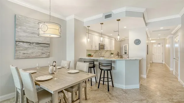 a kitchen with a sink a stove and a microwave