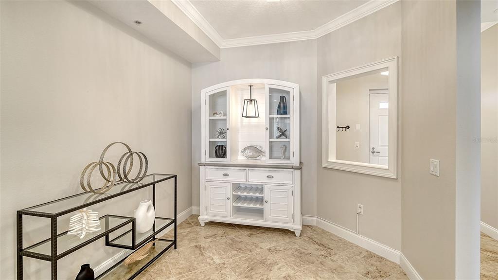 606 Riviera Dunes Way, Unit 306 Palmetto, FL 34221 - Photo 23 of 64 a view of an entryway with wooden floor