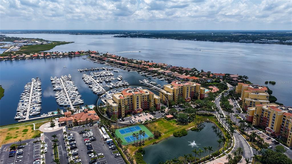 606 Riviera Dunes Way, Unit 306 Palmetto, FL 34221 - Photo 3 of 64 a view of a city with lake