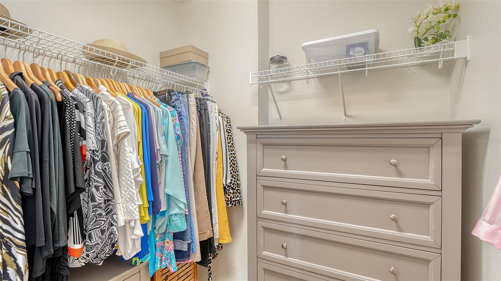606 Riviera Dunes Way, Unit 306 Palmetto, FL 34221 - Photo 32 of 64 a view of walk in closet with clothes and shoes