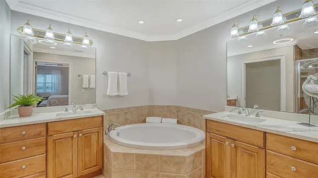 a bathroom with a sink a large mirror and a toilet