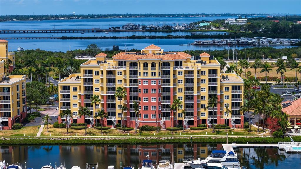 606 Riviera Dunes Way, Unit 306 Palmetto, FL 34221 - Photo 41 of 64 a front view of a building with lake view