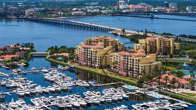 a front view of a house with swimming pool having outdoor seating
