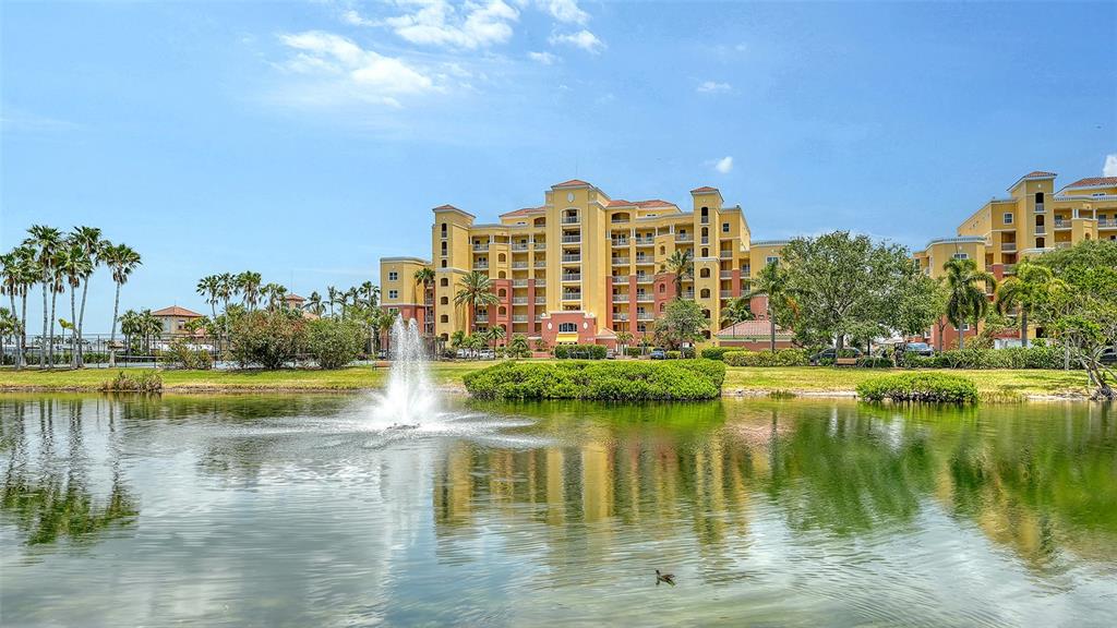 606 Riviera Dunes Way, Unit 306 Palmetto, FL 34221 - Photo 5 of 64 a view of a lake with building in front of it