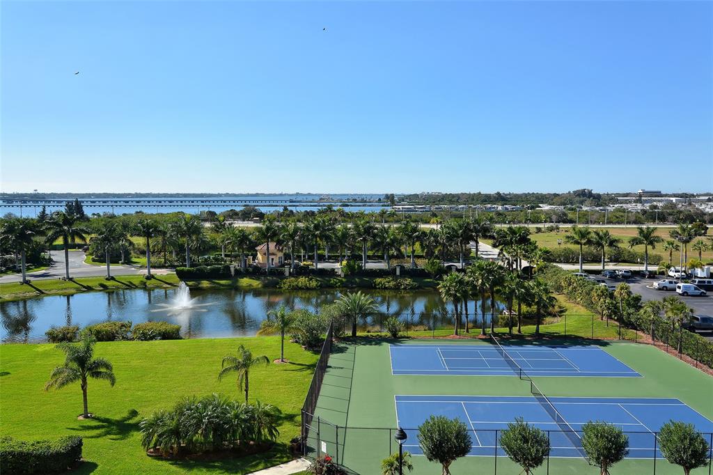606 Riviera Dunes Way, Unit 306 Palmetto, FL 34221 - Photo 59 of 64 a view of a lake with a city