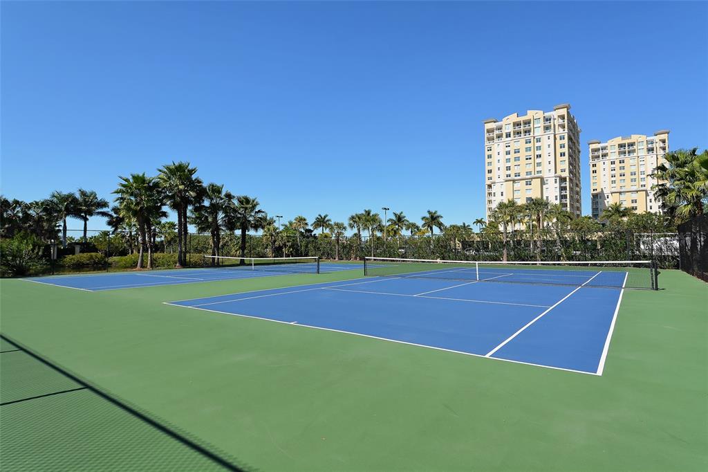 606 Riviera Dunes Way, Unit 306 Palmetto, FL 34221 - Photo 60 of 64 a view of a tennis court