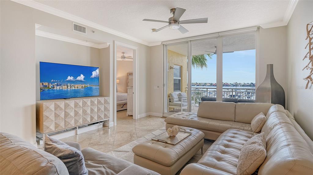 606 Riviera Dunes Way, Unit 306 Palmetto, FL 34221 - Photo 8 of 64 a living room with furniture and a large window