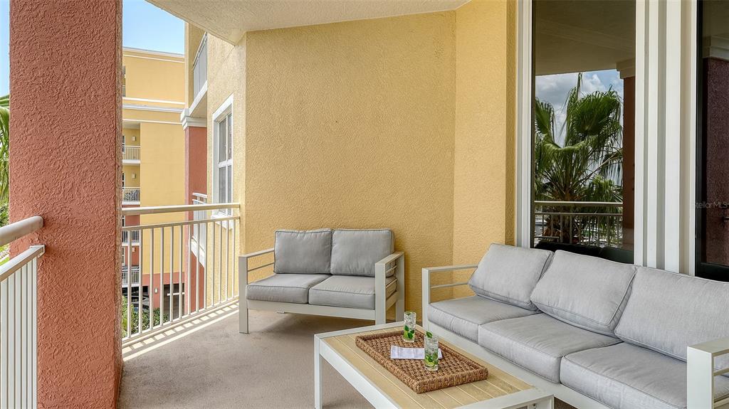 606 Riviera Dunes Way, Unit 306 Palmetto, FL 34221 - Photo 10 of 64 a living room with furniture and a window