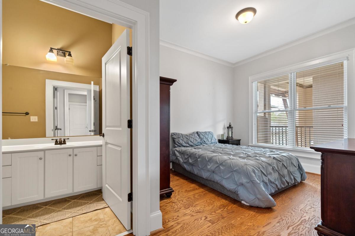 116 (unit 311) Indian Summer Path Eatonton, GA 31024 - Photo 19 of 51 a bedroom with a bed and a window