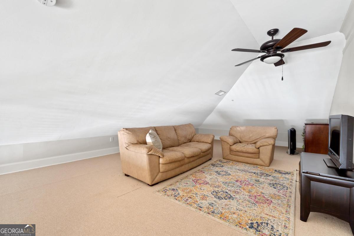 116 (unit 311) Indian Summer Path Eatonton, GA 31024 - Photo 27 of 51 a living room with furniture and a flat screen tv
