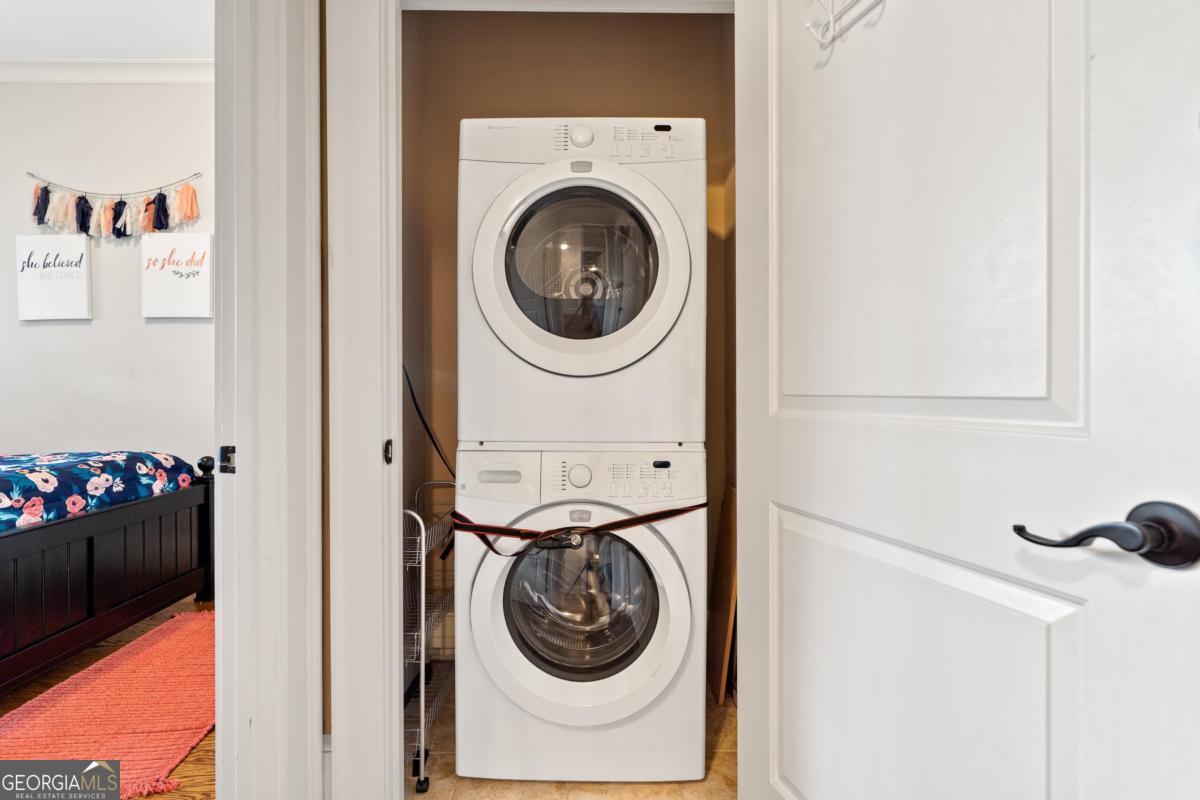 116 (unit 311) Indian Summer Path Eatonton, GA 31024 - Photo 30 of 51 a utility room with dryer and washer