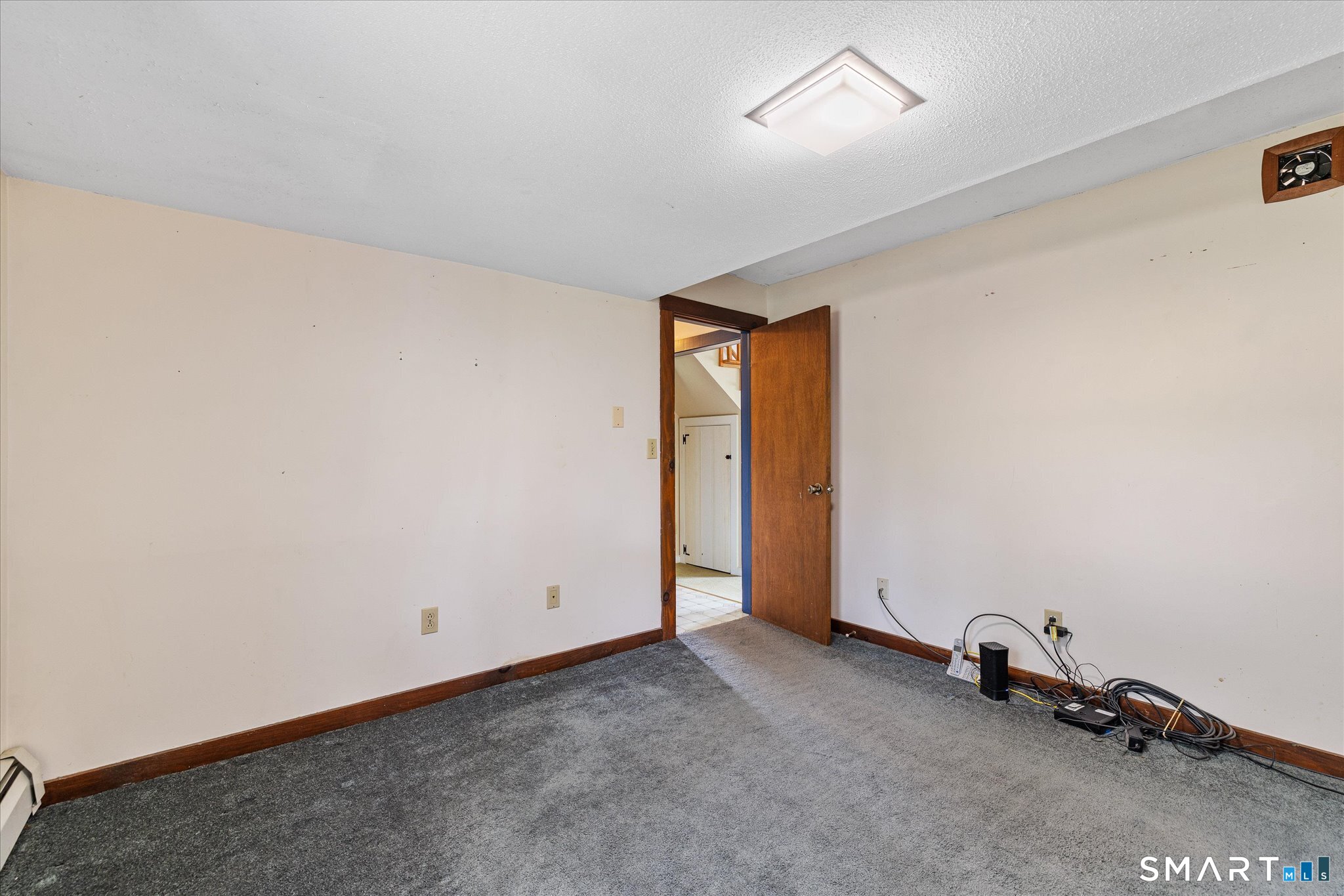 49 Bosworth Road Pomfret, CT 06259 - Photo 28 of 40 an empty room with a door