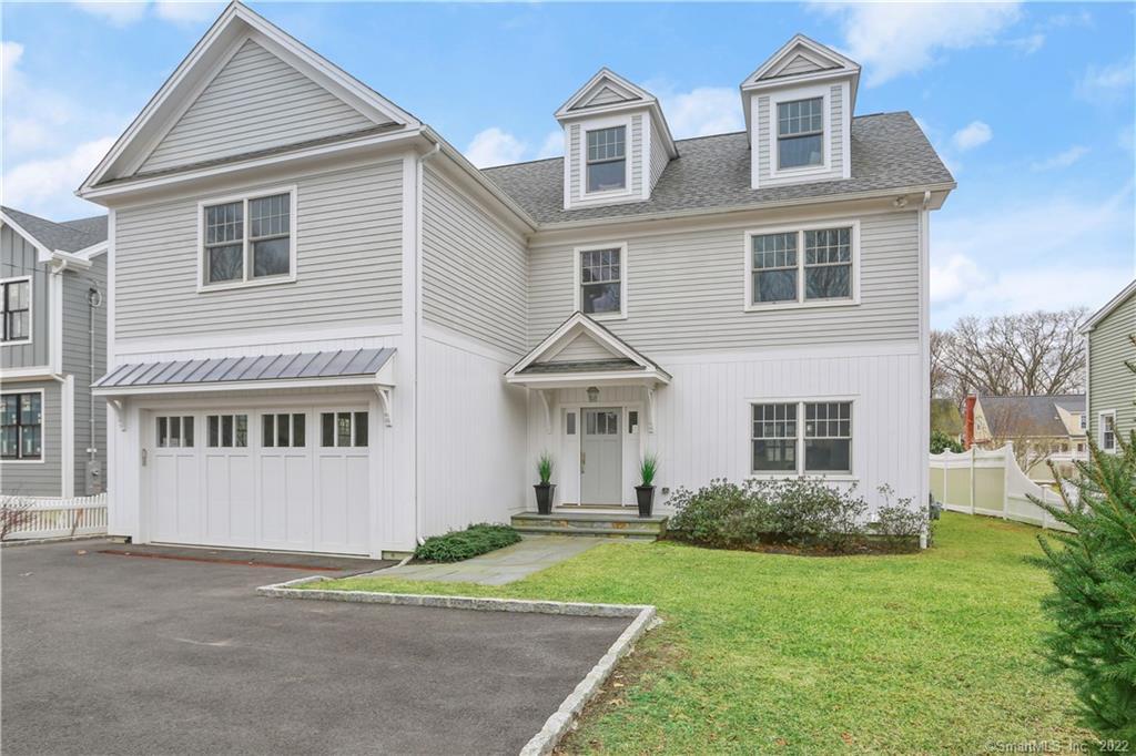 36 Bridge Street Westport, CT 06880 - Photo 1 of 1 a view of a big house with a yard and plants