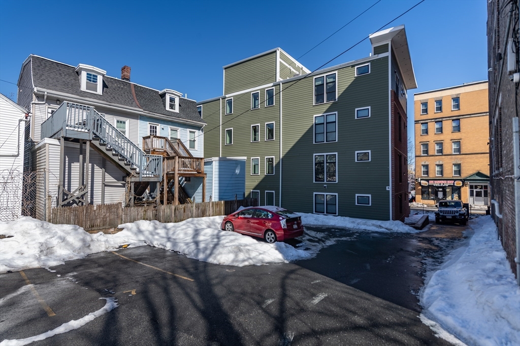 299 Dudley Street Boston, MA 02119 - Photo 17 of 18 a street view with tall buildings