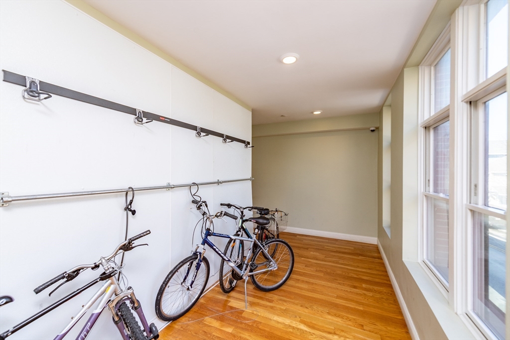 299 Dudley Street Boston, MA 02119 - Photo 6 of 18 a view of an empty room with wooden floor