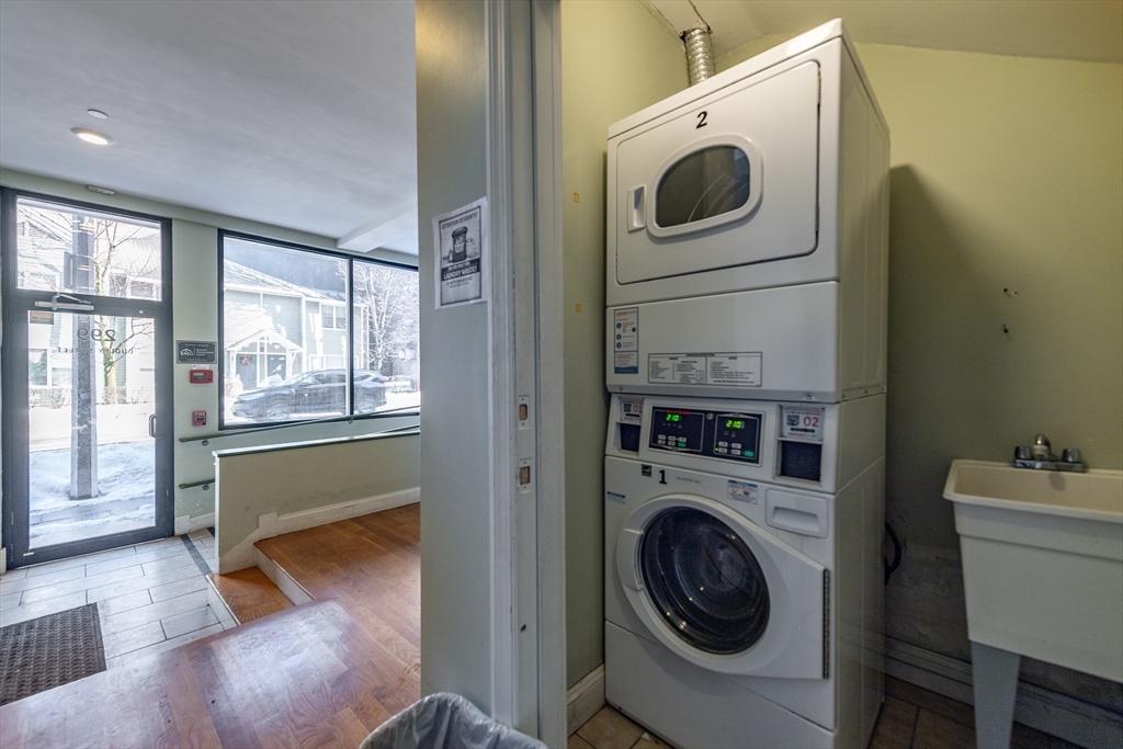 299 Dudley Street Boston, MA 02119 - Photo 7 of 18 a utility room with dryer and washer