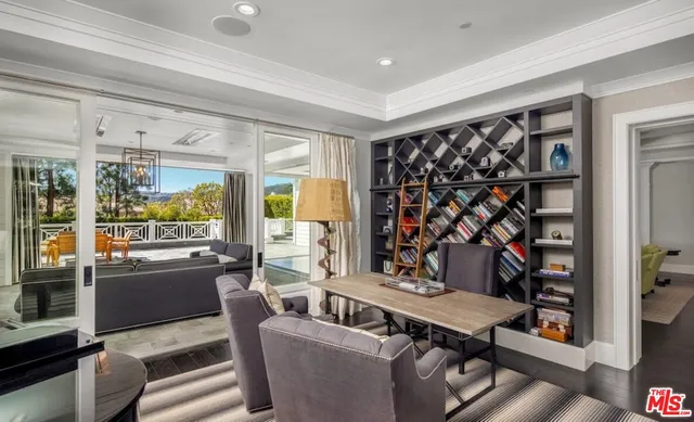 a living room with furniture a rug and a window