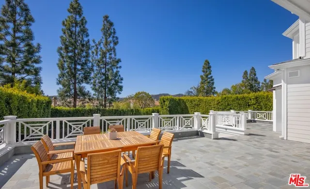 a view of a chairs and table on the terrace