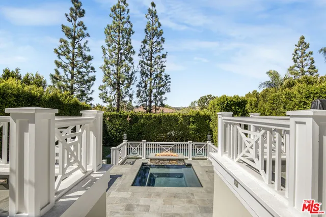 a view of a balcony with wooden fence