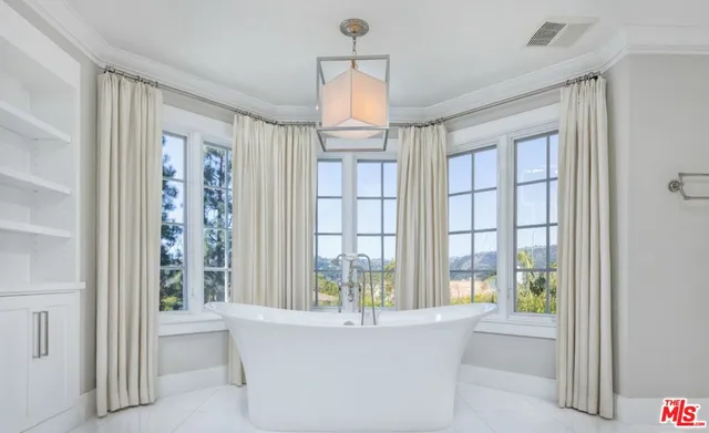a view of an entryway with a chandelier