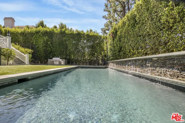 a view of multi story residential apartment building with a yard