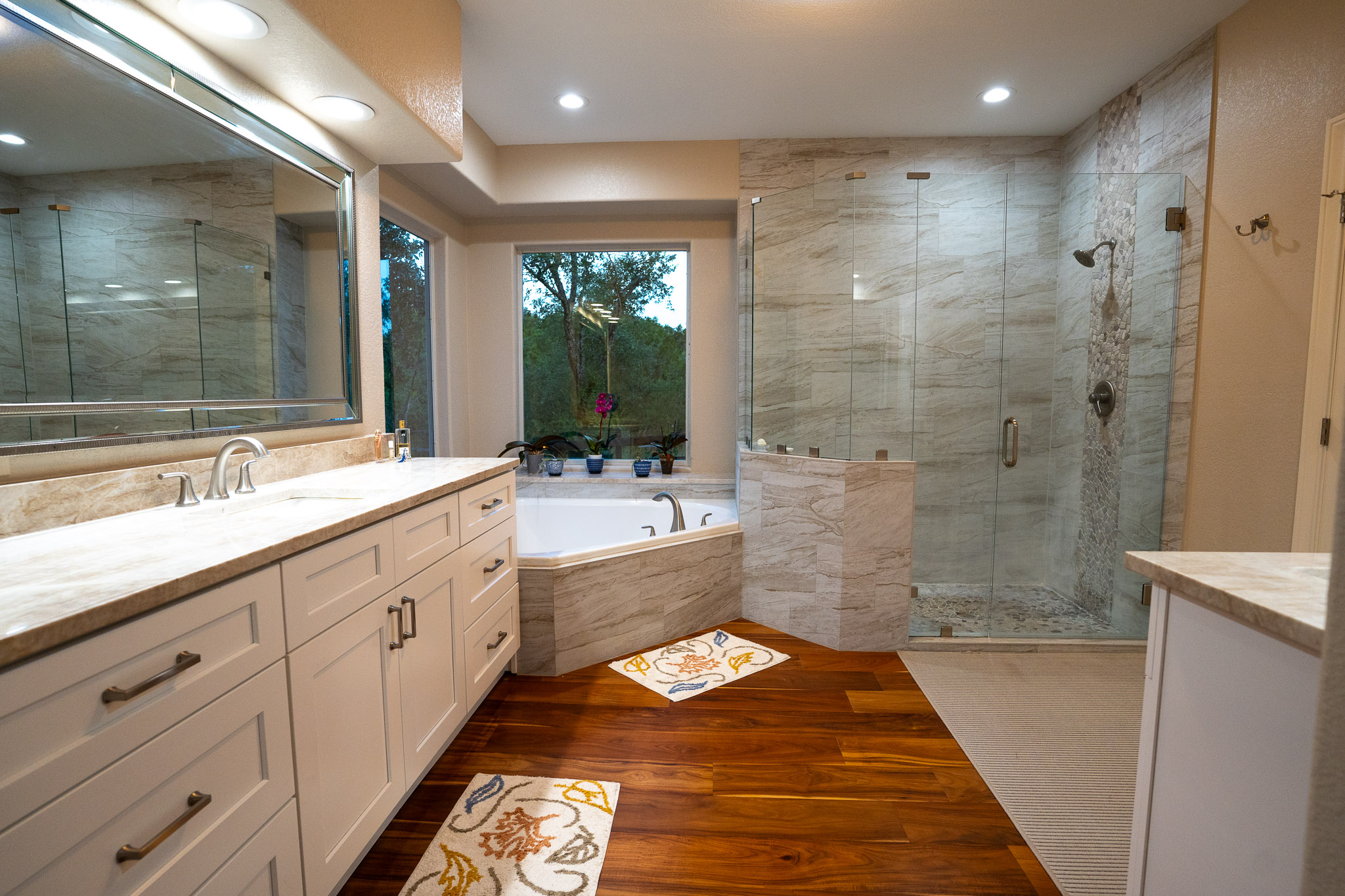 13800 Lone Rider Trail Austin, TX 78738 - Photo 16 of 32 Indulge in a tranquil bathing experience with this bathroom's soaking tub and spacious walk-in shower.