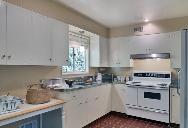 1935 Mission Ridge Road Santa Barbara, CA 93103 - Photo 4 of 10 a kitchen with cabinets appliances a sink and a window