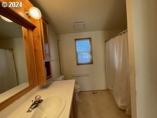 1923 18th Street Baker City, OR 97814 - Photo 11 of 15 a bathroom with a sink and a mirror