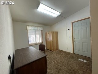 1923 18th Street Baker City, OR 97814 - Photo 14 of 15 a view of a workspace with furniture and window