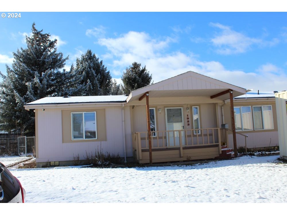1923 18th Street Baker City, OR 97814 - Photo 2 of 15 a front view of a house with a yard