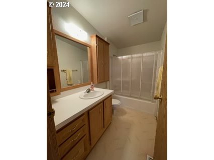 1923 18th Street Baker City, OR 97814 - Photo 9 of 15 a bathroom with a sink a mirror and a shower