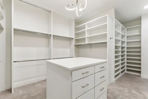 an empty room with windows and pillars in it