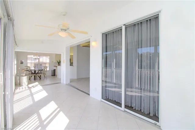 a view of a livingroom with wooden floor and a flat screen tv