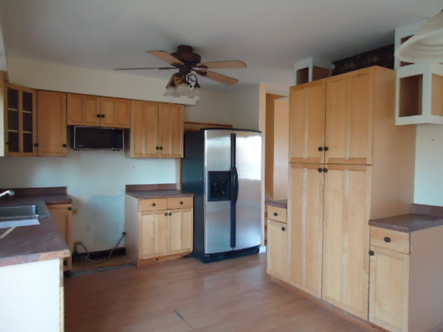 343 Gehrig Circle Bolingbrook, IL 60440 - Photo 6 of 16 a view of a kitchen with a refrigerator and a stove top oven